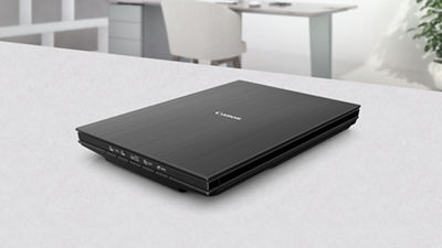 CANOSCAN LiDE PHOTO SCANNER sits on a desktop